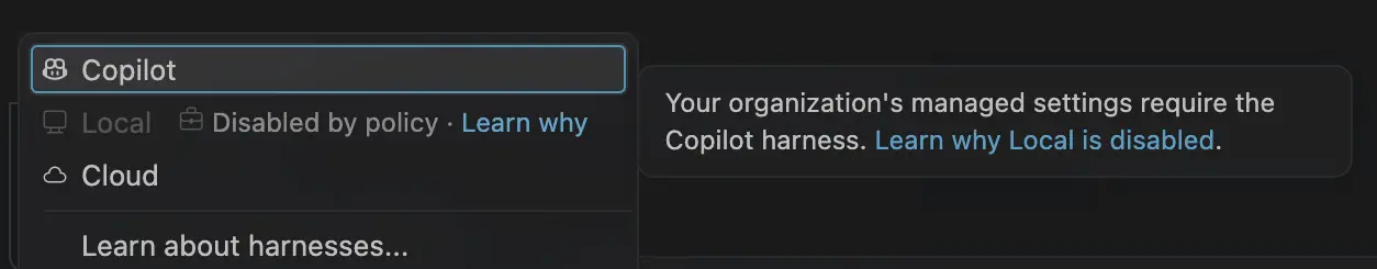 Screenshot showing Local disabled by policy in the harness picker, with a Learn why link explaining that the organization requires Copilot.